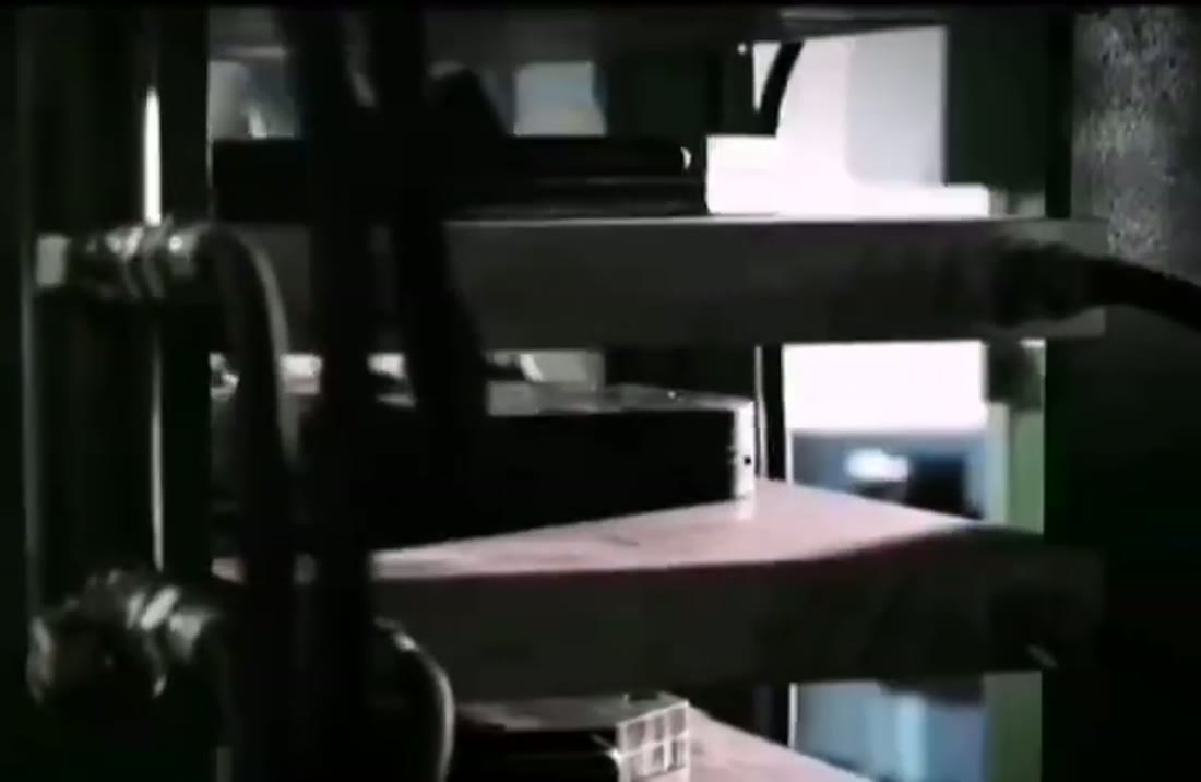 Operator releasing a pickleball paddle from a thermoforming mold