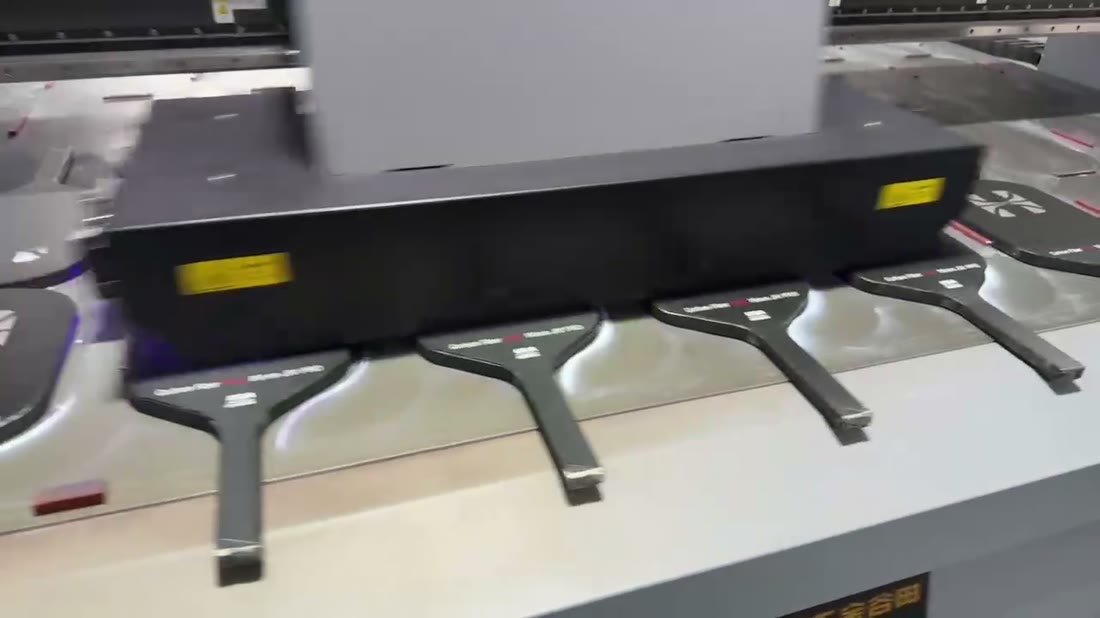 UV printer applying artwork to pickleball paddles